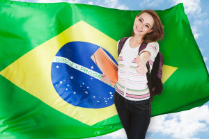 Young-smiling-female-over-the-Brazilian-flag