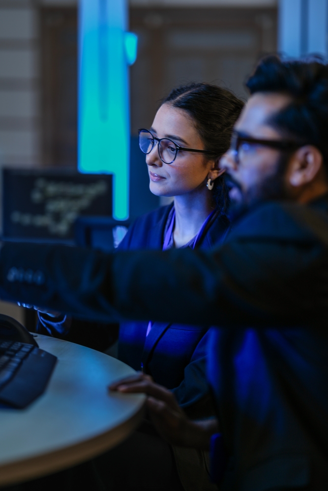 team of AI Agents RAG systems fine-tuned LLM fully focused looking at monitors